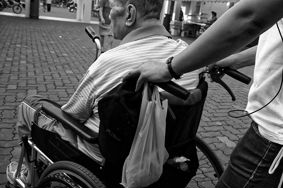 Carer Pushing an elderly person